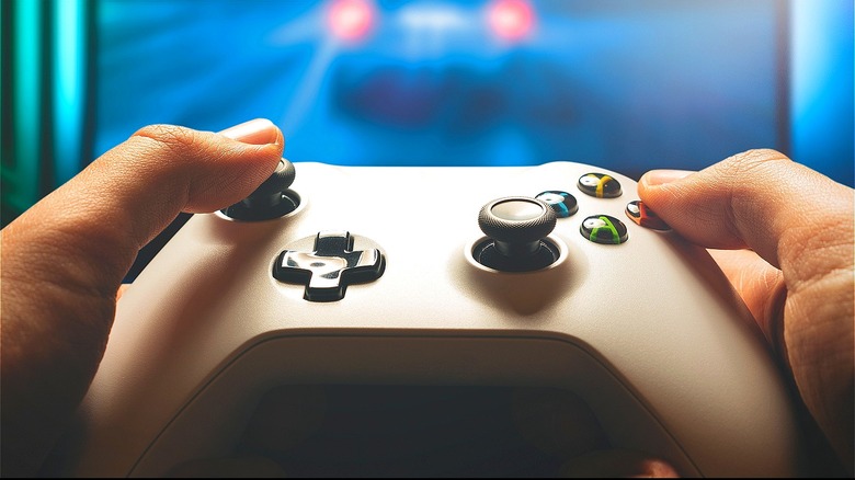 Hand holding video game controller