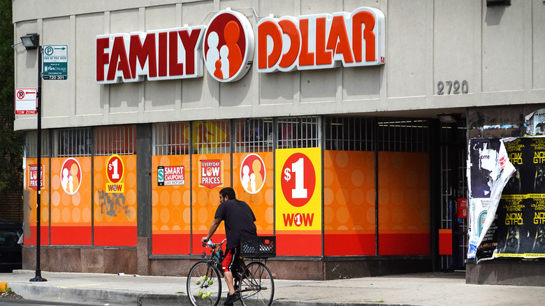 Man on bike in front of Family Dollar store