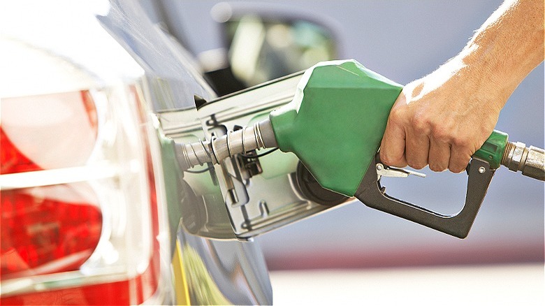 Driver pumping gas in car