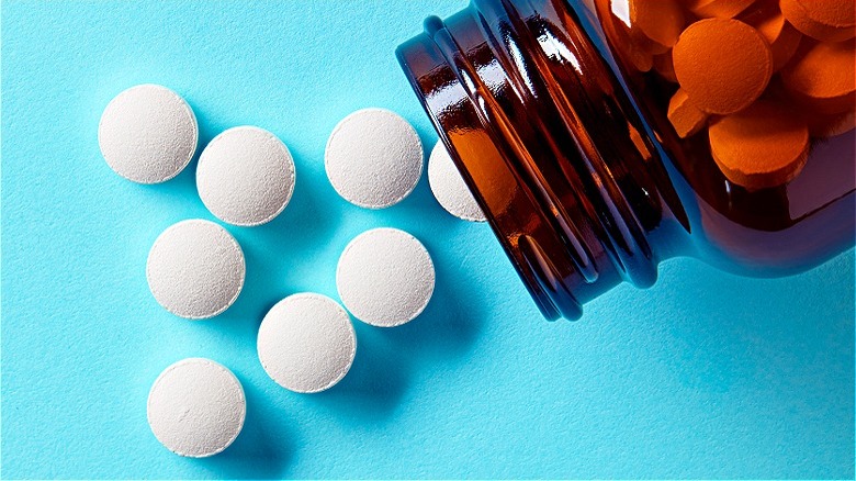 Pills spilling from bottle