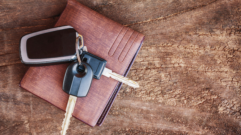 keys resting on top of a wallet on a table