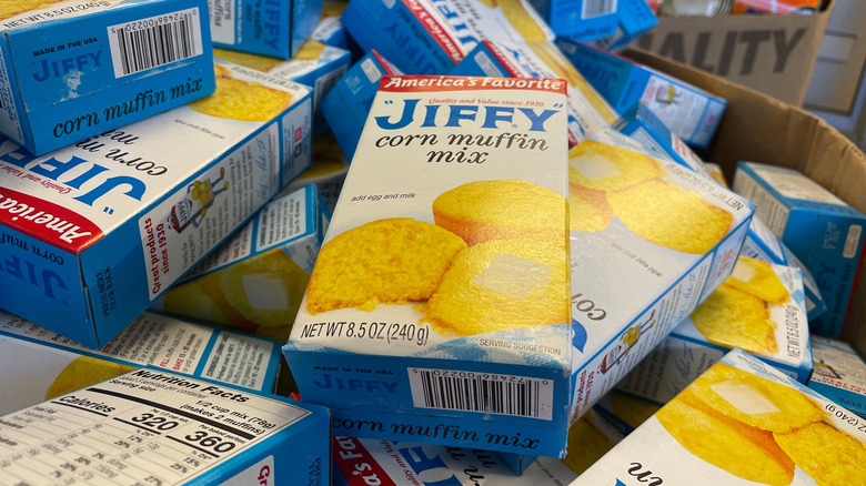 Jiffy Corn Muffin Mix boxes in a pile at a store