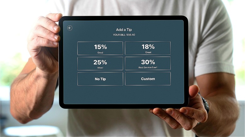 Person holding tip screen