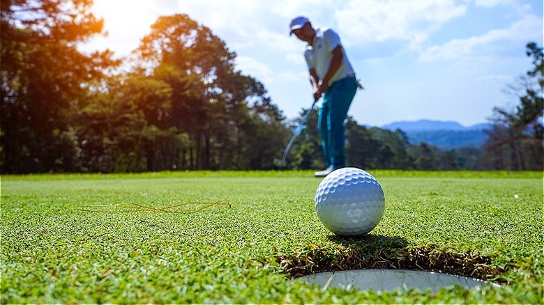 Putted golf ball near hole