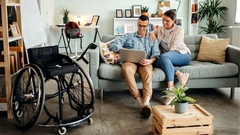 Disabled person sitting on couch