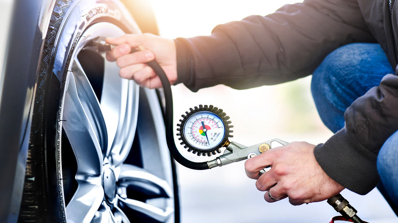 Man filling car tire