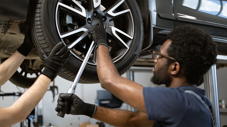 Mechanics working on a vehicle
