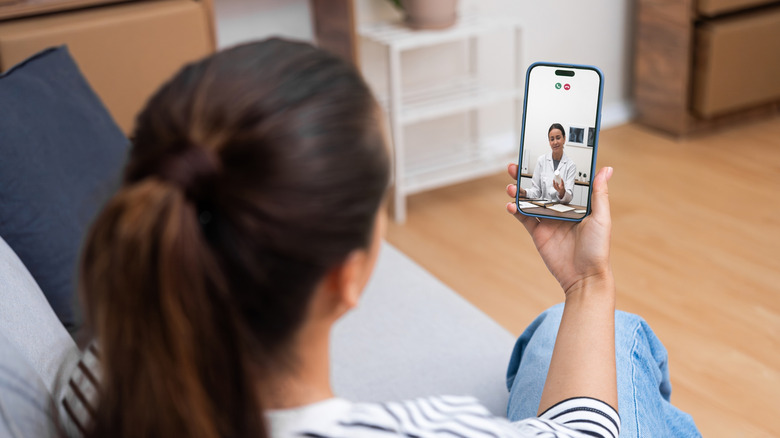 Patient talks to doctor about medication via smartphone