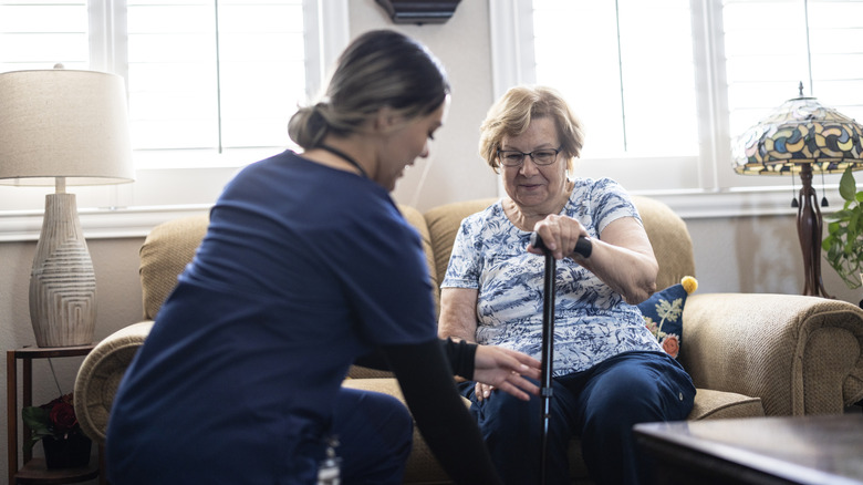 Nurse provides in-home care appointment for elderly woman