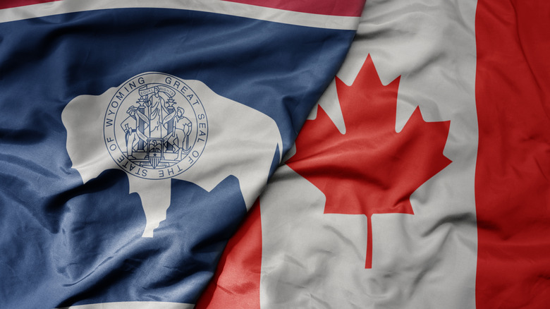The Wyoming state flag next to the Canada flag