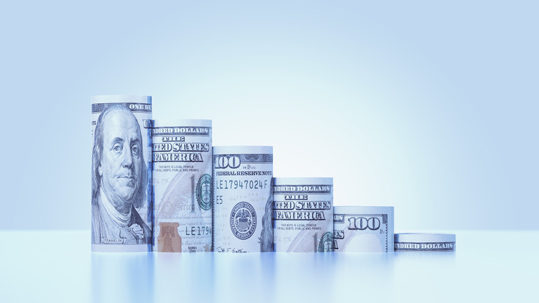 Hundred-dollar bills folded in shrinking sizes