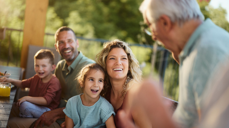 Older man with his happy family