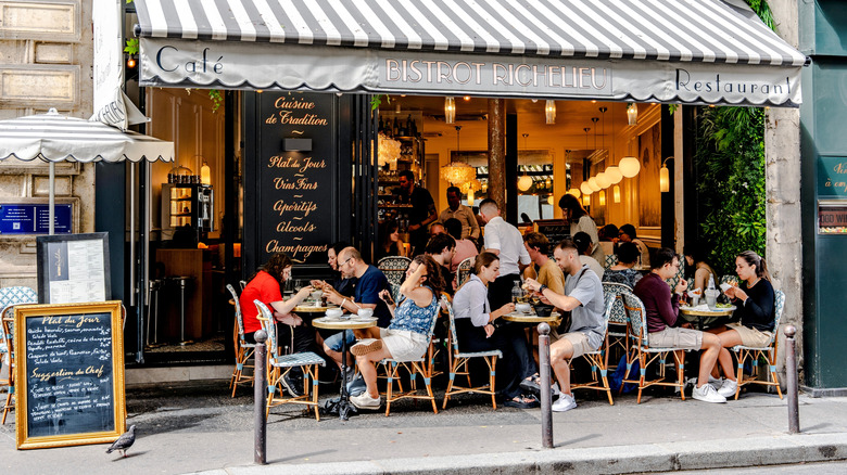 Diners at a sidewalk cafe in France