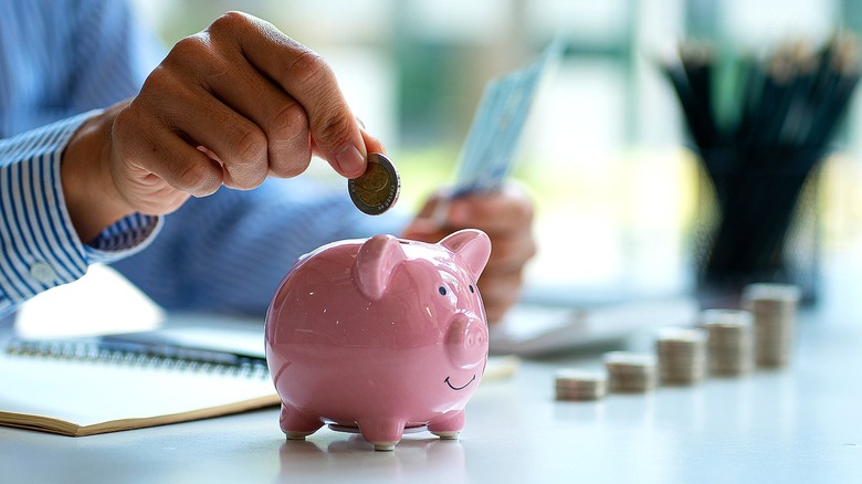 saving coins in piggy bank