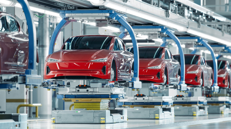 Tesla cars on factory assembly line