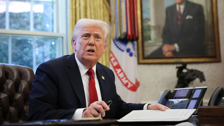 President Trump signing a document
