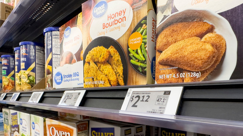 Digital price tags with Walmart Great Value products above them on a shelf.