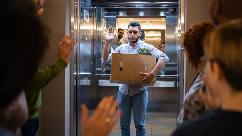 Man fired from job leaving with box of belongings