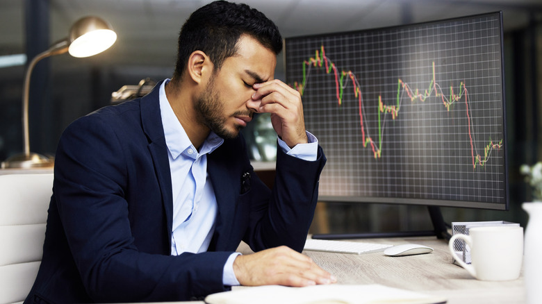 Upset businessman worried about bad stock market performance