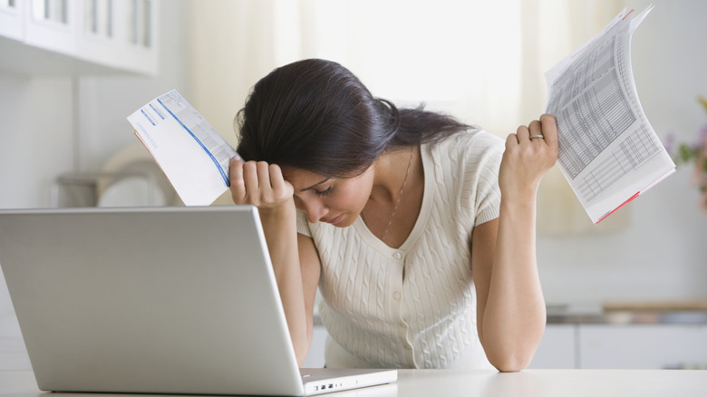 A woman looking worried about bills