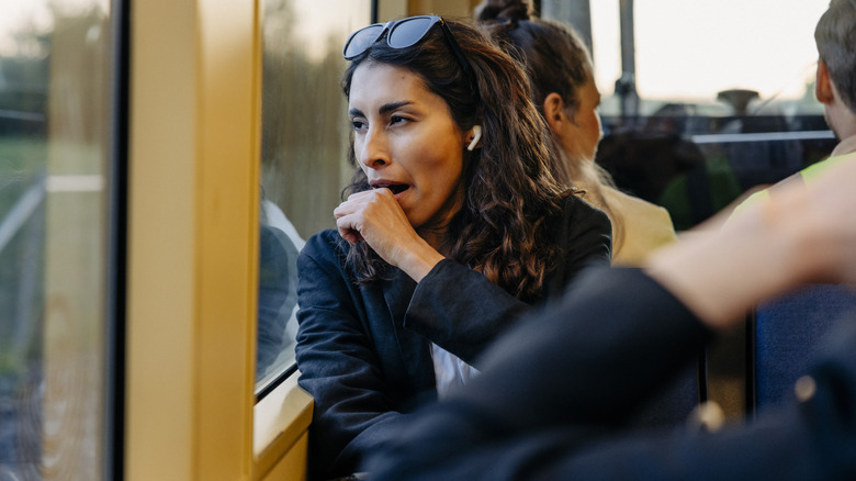 A woman yawning in public