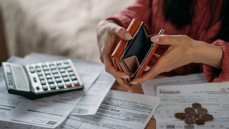 empty wallet with bills to pay