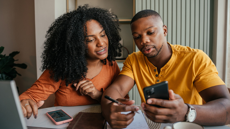 Young couple managing finances.