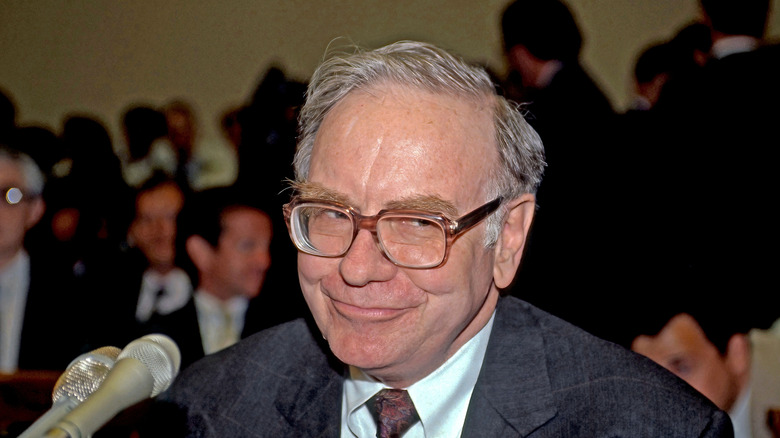 a coffee mug with Warren Buffett and some advice on side