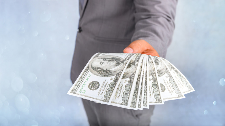 Businessmen hand to send money, bank notes, catch money, payment concepts