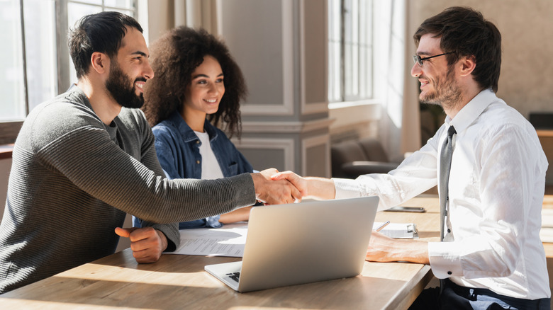 A couple meeting with a mortgage loan broker