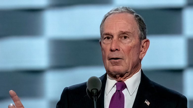 Michael Bloomberg speaking into a microphone