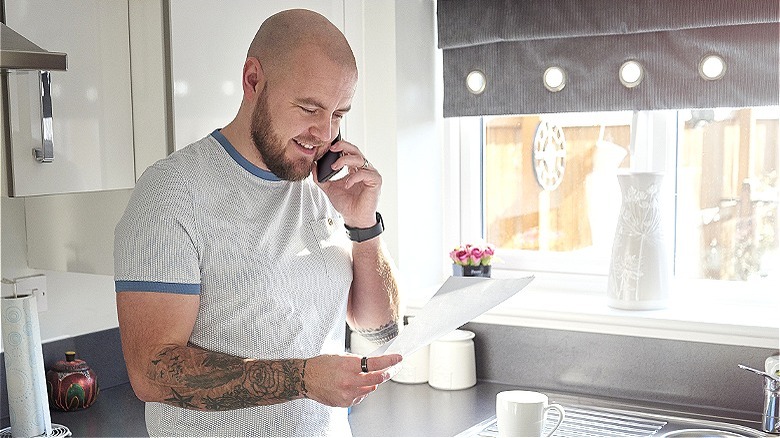Person on phone discussing finances