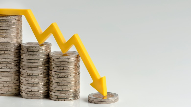 coins and downward arrow