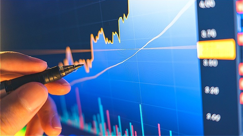 Person marking stock growth chart