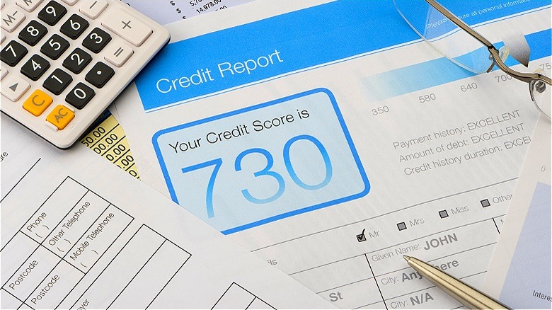 Credit report shown with calculator