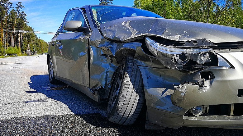 Totaled car close-up on pavement