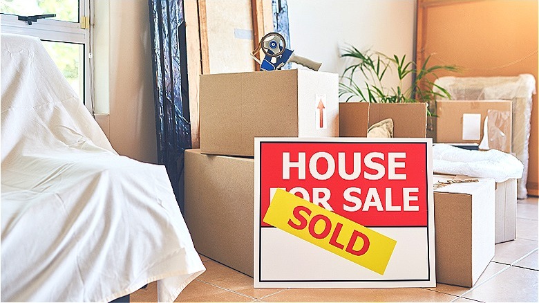 Couple with house moving boxes