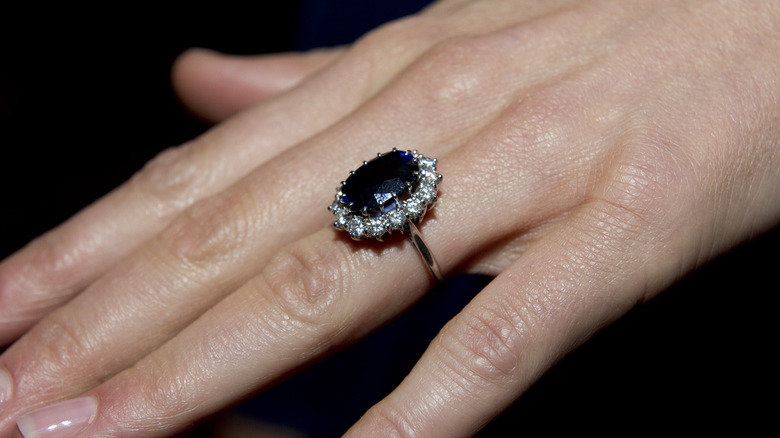 Close up of Kate Middleton's hand and Princess Diana's engagement ring