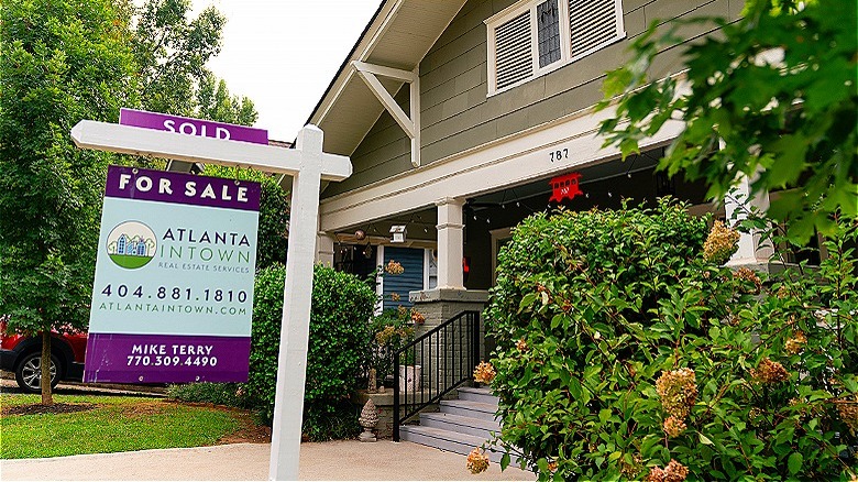House with for sale sign