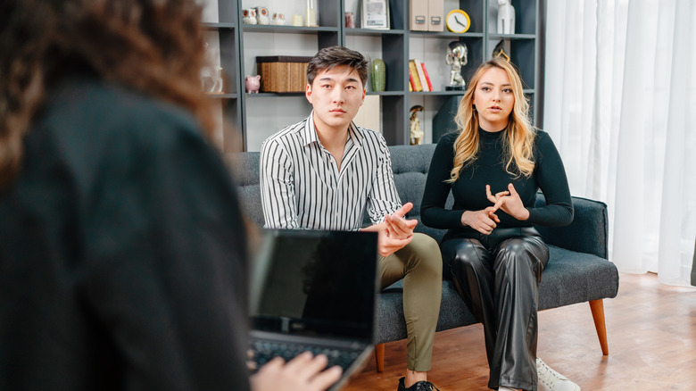 Couple talking to advisor