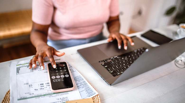 Woman calculating her finances