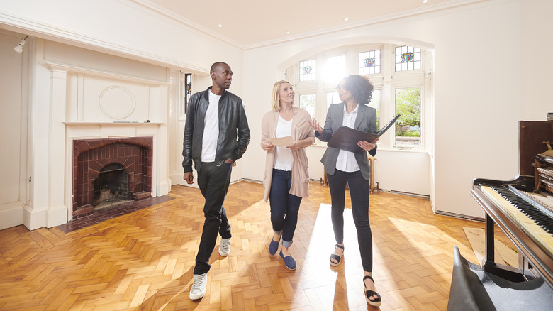 Couple house shopping with realtor