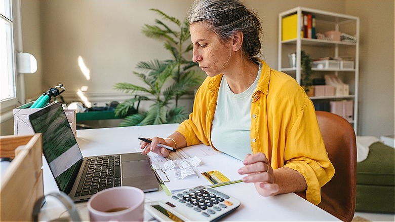 Person making calculations at home