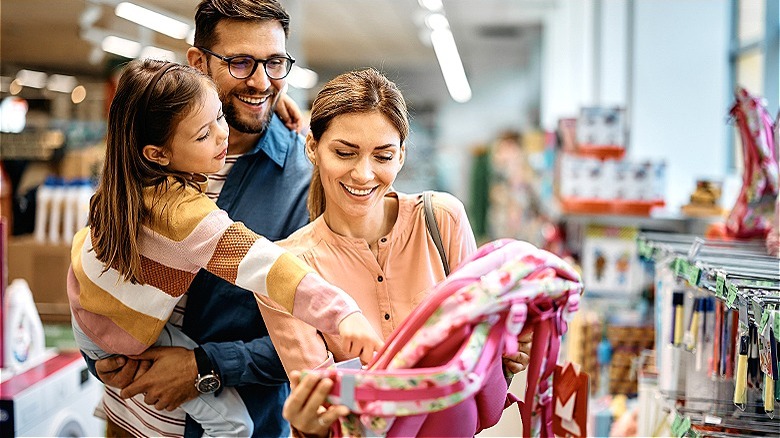 Family shopping for daughter's backpack