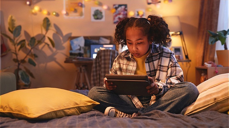 Gen Alpha girl on tablet