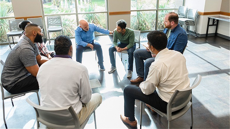 Support group sitting in circle