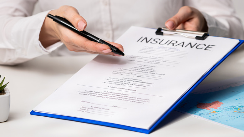 A life insurance contract on a keyboard.
