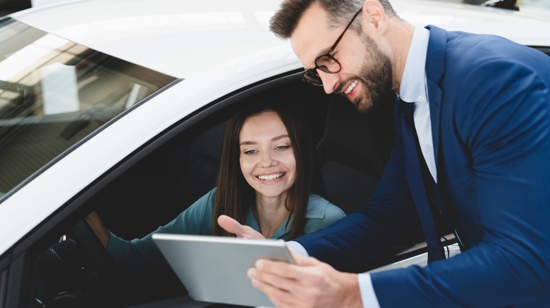 buyer sitting in car discussing deal