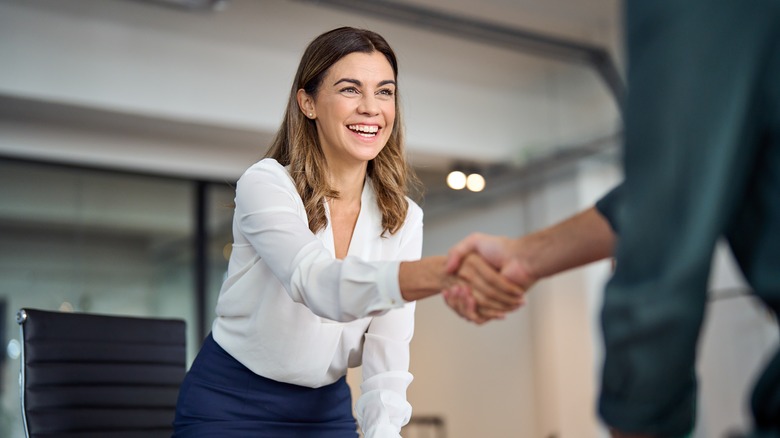 shaking hands in an office