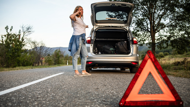 woman with broken down car